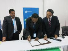Signing of ECREEE - SIDS DOCK MOU: Kenneth Darroux, Minister for the Environment, Natural Resources, Physical Planning and Fisheries of Commonwealth of Dominica(middle) signs the Memorandum of Understanding between SIDS DOCK and the ECOWAS ECREEE. Also in photo: Antonio Batista, Energy Director of Ministry of Industry, Tourism and Energy in the Republic of Cabo Verde(left), and Pradeep Monga, Director of the UNIDO's Energy and Climate Change Branch.